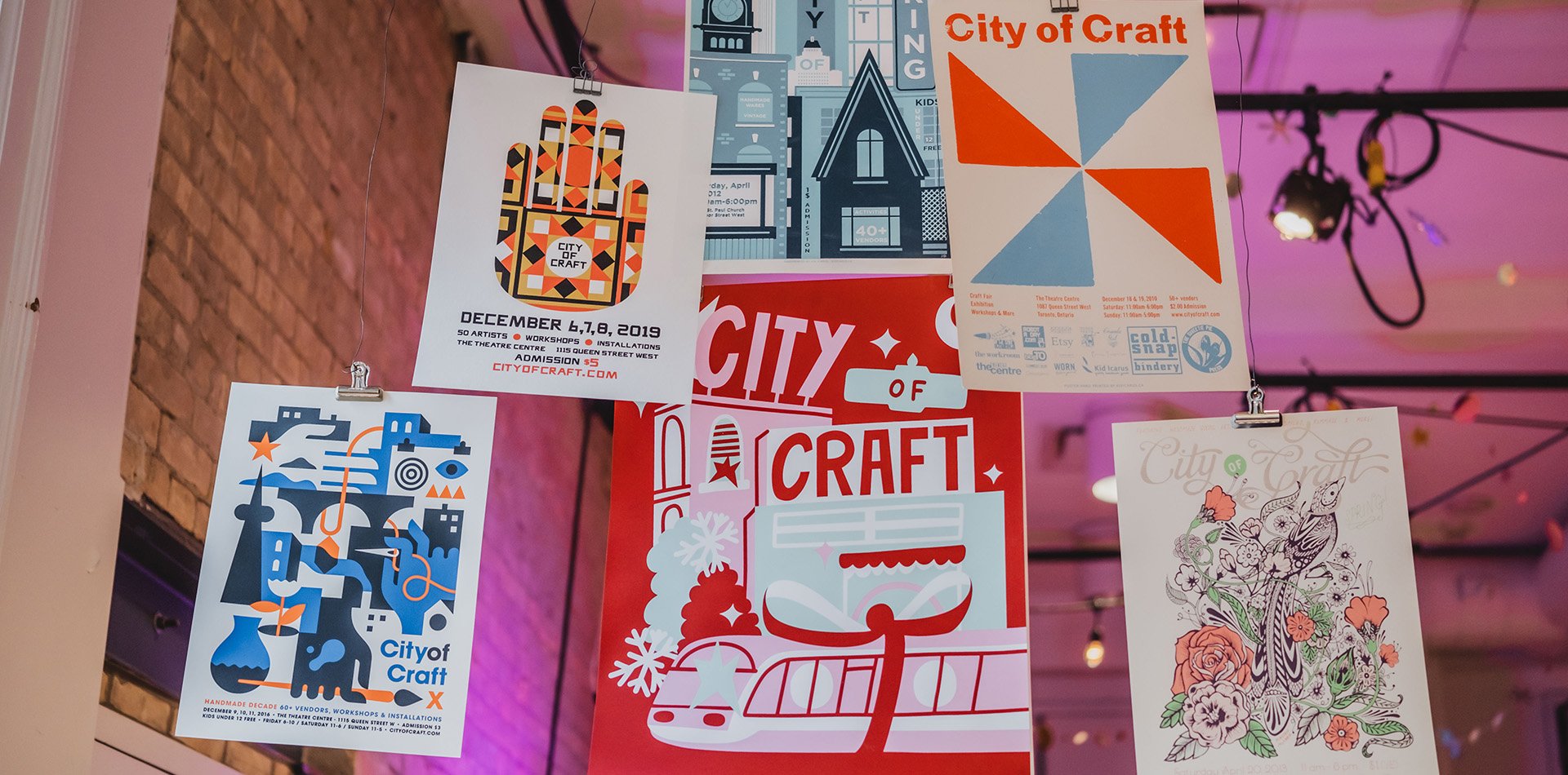 colourful and illustrated by different artists each year, city of craft posters from previous markets hang from the theatre centre's gallery ceiling.