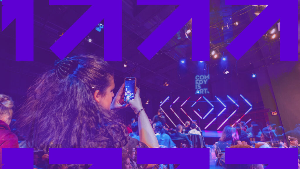 audience member takes a photo of comedy is art